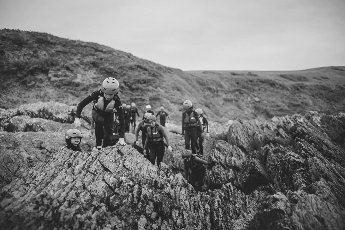 kids coasteering adventure along baggy point in a school trip